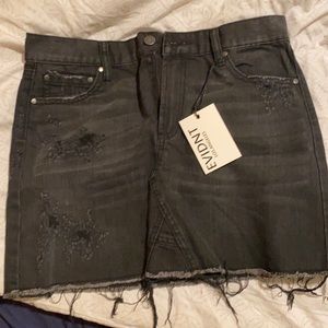 Faded black distressed denim skirt